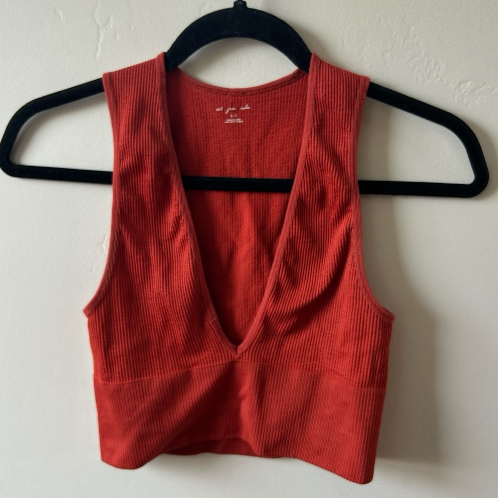 Reddish orange plunge crop top